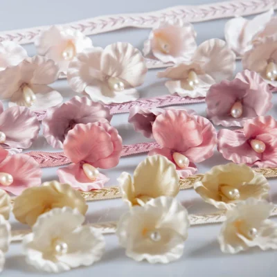 Multicolor 3D floral lace trim with pearl centers in pink, cream, and yellow tones