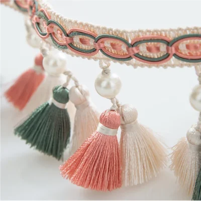 Close-up of Annecy Tassel Curtain Trim with multicolor mini tassels and pearl bead accents