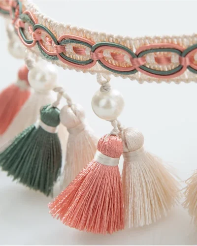 Close-up of Annecy Tassel Curtain Trim with multicolor mini tassels and pearl bead accents