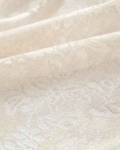 Sheer curtain fabric with openwork floral lace pattern and light-filtering jacquard weave