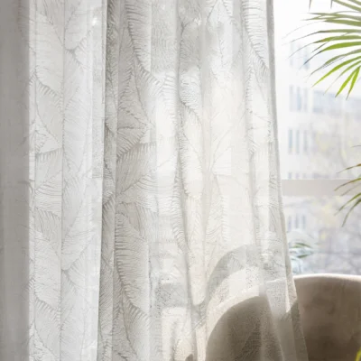 Botanic Veil Curtain filtering soft natural light with botanical patterns visible against an outdoor backdrop