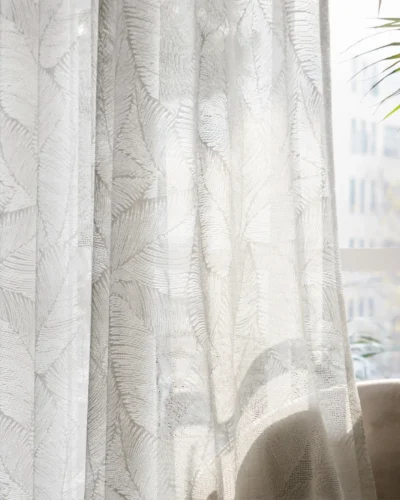 Botanic Veil Curtain filtering soft natural light with botanical patterns visible against an outdoor backdrop