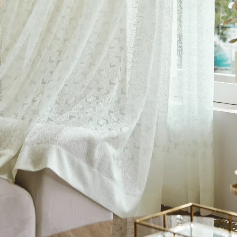 Blossom Veil Sheer Curtain with soft bloom lace draping near a window