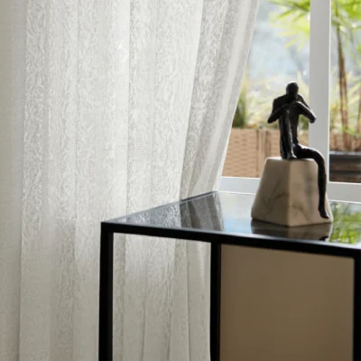 Whisper Texture jacquard sheer curtain with soft daylight and decorative side table