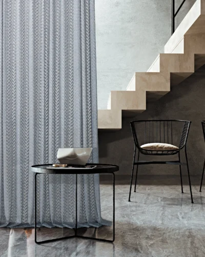 Zigzag sheer curtain in a modern loft interior with stairs and accent chairs
