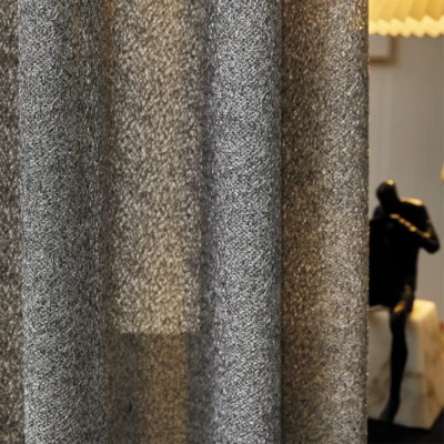 Lightflow lace curtain with subtle ripple texture, styled in a softly lit modern room.