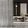 Ripple sheer curtain in modern living space with floor-to-ceiling installation and soft vertical folds.