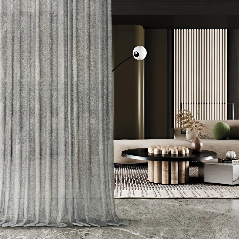 Ripple sheer curtain in modern living space with floor-to-ceiling installation and soft vertical folds.
