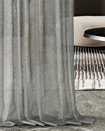 Ripple sheer curtain with wave-like texture softly draping in a modern living room.