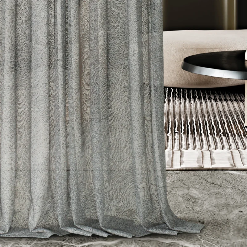 Ripple sheer curtain with wave-like texture softly draping in a modern living room.
