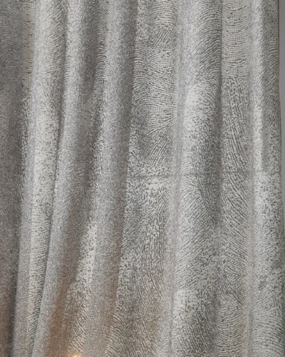 Ripple sheer curtain with subtle wave texture, softly flowing with natural light.
