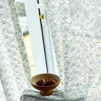 Sheer Botanical Lace Curtain with Natural Light and Decorative Bowl