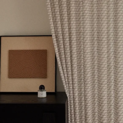 Beige jacquard sheer curtain with geometric weave in modern interior