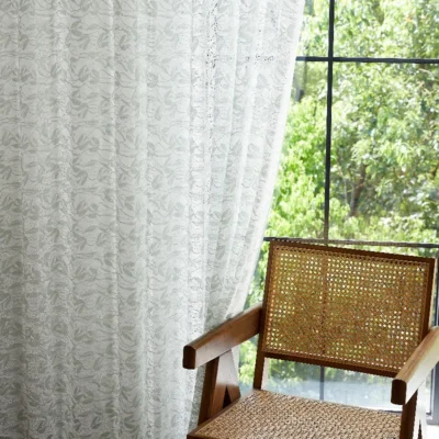 Dual-tone jacquard sheer curtain with willow leaf pattern, softly filtering light in a natural interior setting.