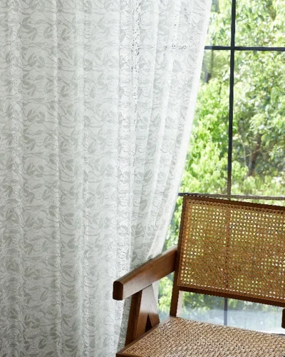 Dual-tone jacquard sheer curtain with willow leaf pattern, softly filtering light in a natural interior setting.