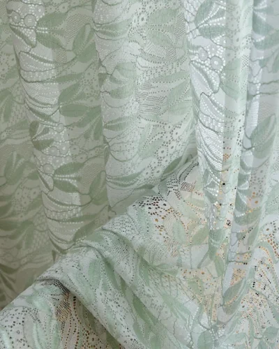 Close-up of Willow Whisper Curtain – dual-tone jacquard sheer with soft green leaf texture.