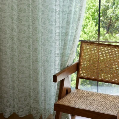 Willow Whisper Curtain hanging beside a wooden chair in soft daylight.