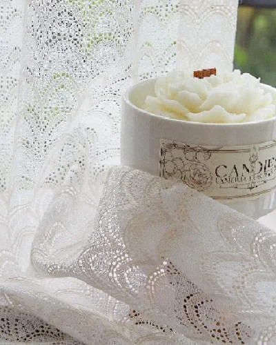 Sheer jacquard curtain with delicate scale-like patterns and soft drape