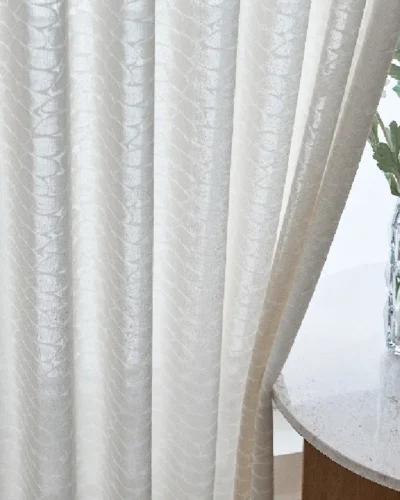 Close-up of Echo Leaf Curtain with jacquard texture beside a round table and vase