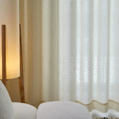 Echo Leaf sheer curtain softly glowing under warm interior light