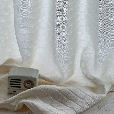 Echo Leaf curtain draped near a window with radio decor, showing soft light and jacquard texture
