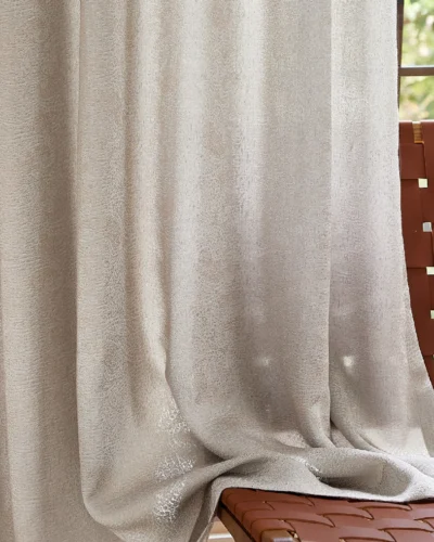 Close-up of dune-inspired textured jacquard curtain with elegant drape