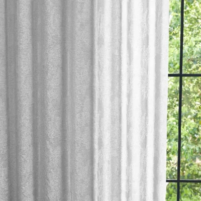 Dual veil jacquard curtain softly filtering daylight by the window
