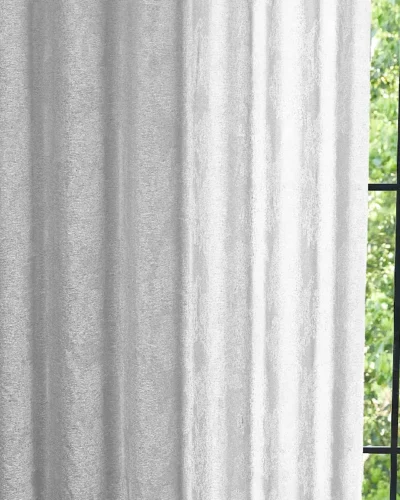 Dual veil jacquard curtain softly filtering daylight by the window