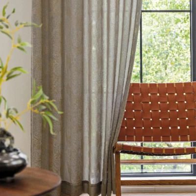 Dual veil jacquard curtain with soft grey tones and natural light filtering