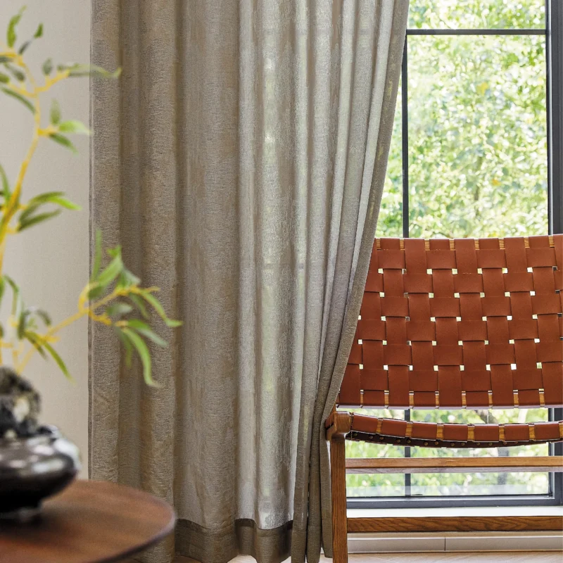 Dual veil jacquard curtain with soft grey tones and natural light filtering