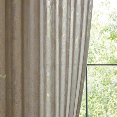 Close-up of dual veil jacquard curtain with layered sheer texture and soft light