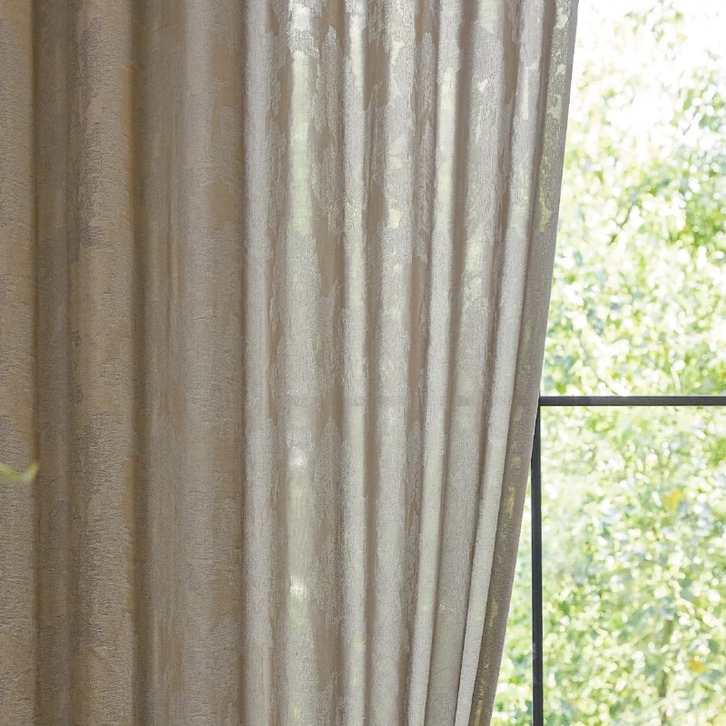 Close-up of dual veil jacquard curtain with layered sheer texture and soft light