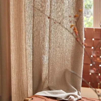 Natural brown chenille sheer curtain with textured weave and filtered sunlight