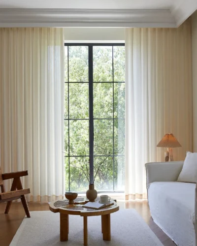 Botanical Jacquard Sheer Curtain hanging in a bright minimalist living room