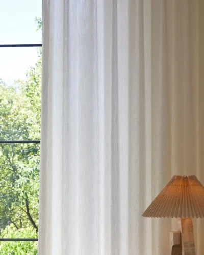 Botanical Jacquard Sheer Curtain with soft light beside a warm-toned table lamp