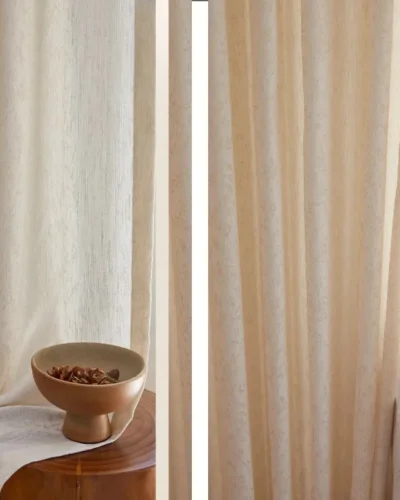 Close-up of botanical jacquard sheer curtain with soft light and wooden decor