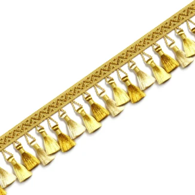 French-style curtain tassel trim in gold with integrated woven band