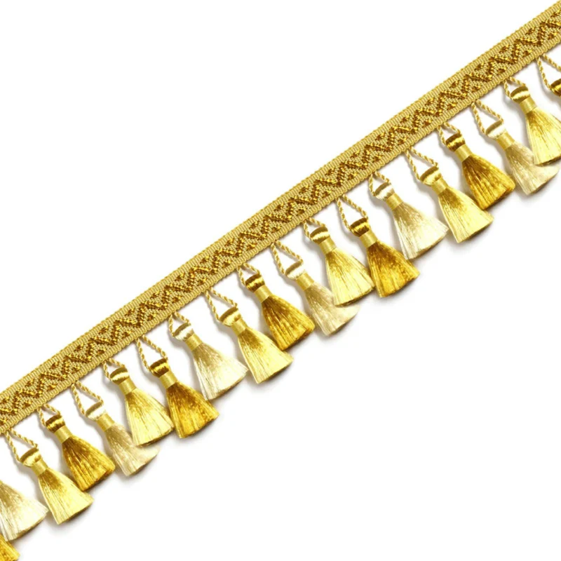 French-style curtain tassel trim in gold with integrated woven band