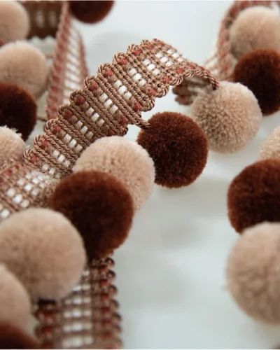 Mocha and blush velvet pom pom fringe trim with soft texture for curtains, cushions, and decor accents.