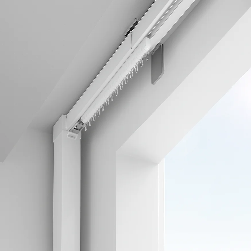 3D view of a white ceiling-mounted curtain track at a window corner, seen from below.