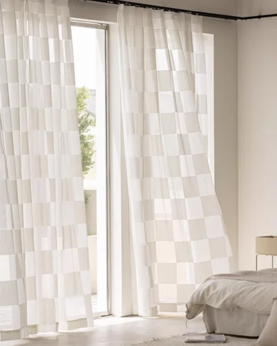 Block Stripe Sheer Curtain – soft beige check voile hanging in a bright bedroom window.