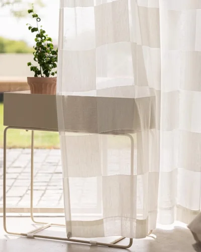 Block Stripe Sheer Curtain – soft beige check voile by a window with potted plant.