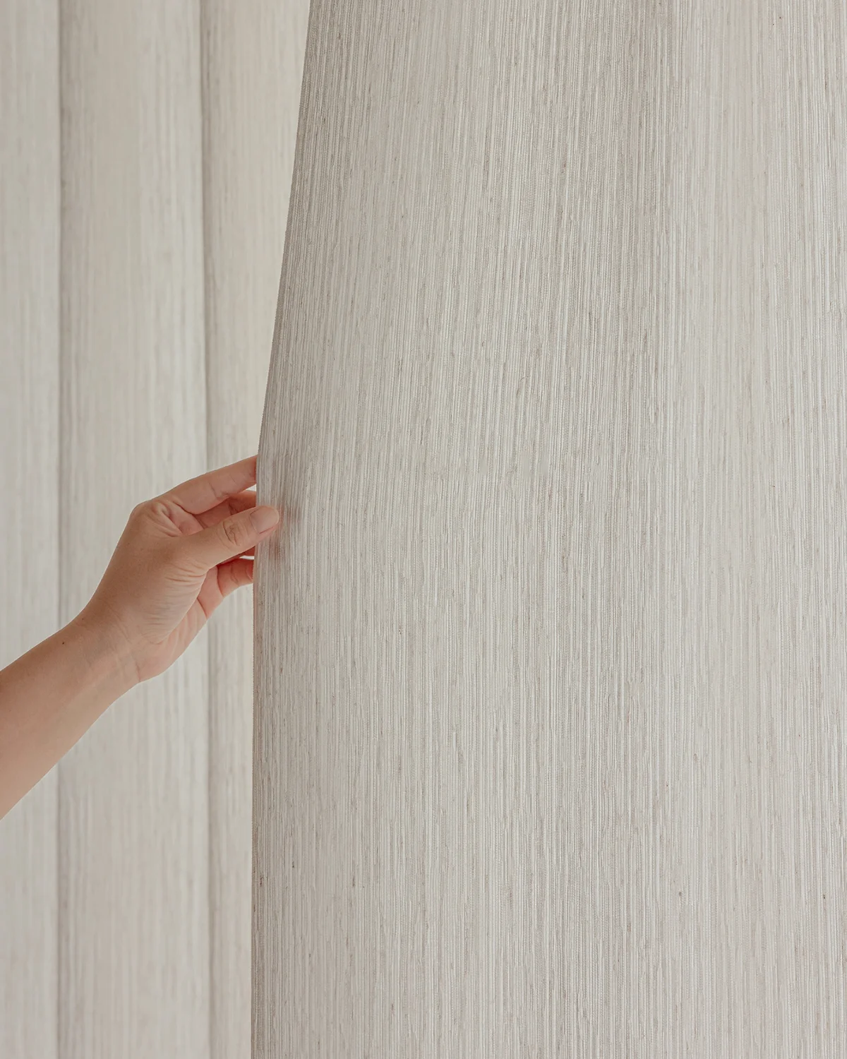 Ridge Texture Curtain – hand touching soft cream woven textured curtain fabric