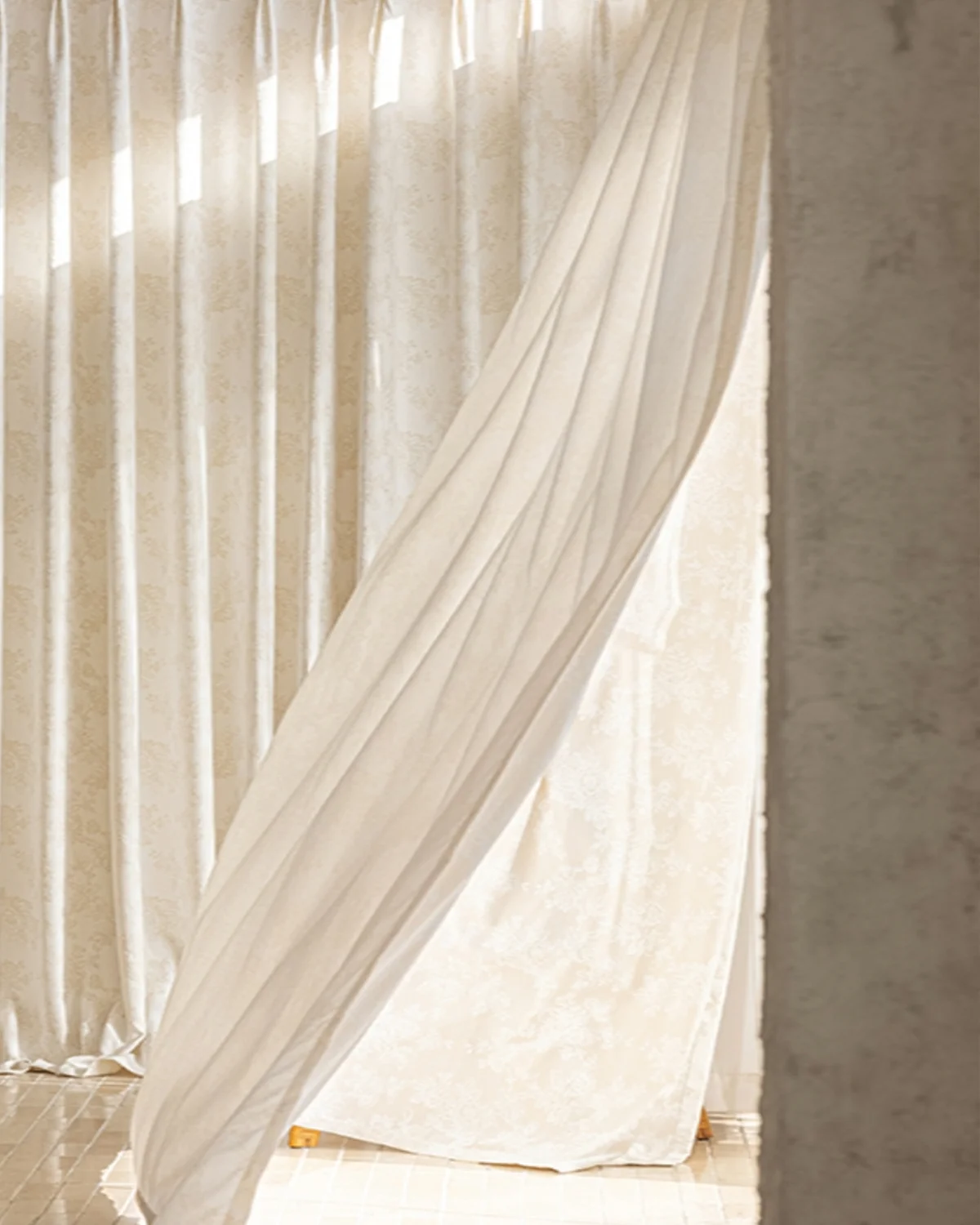 Soft beige floral jacquard shade curtain draped by a window, textured fabric with gentle light.