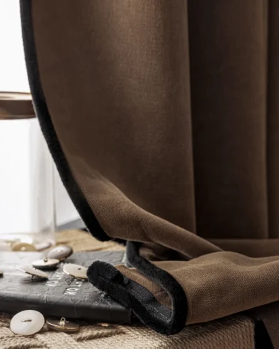 Mocha blackout curtain with tieback and decor styled on the floor