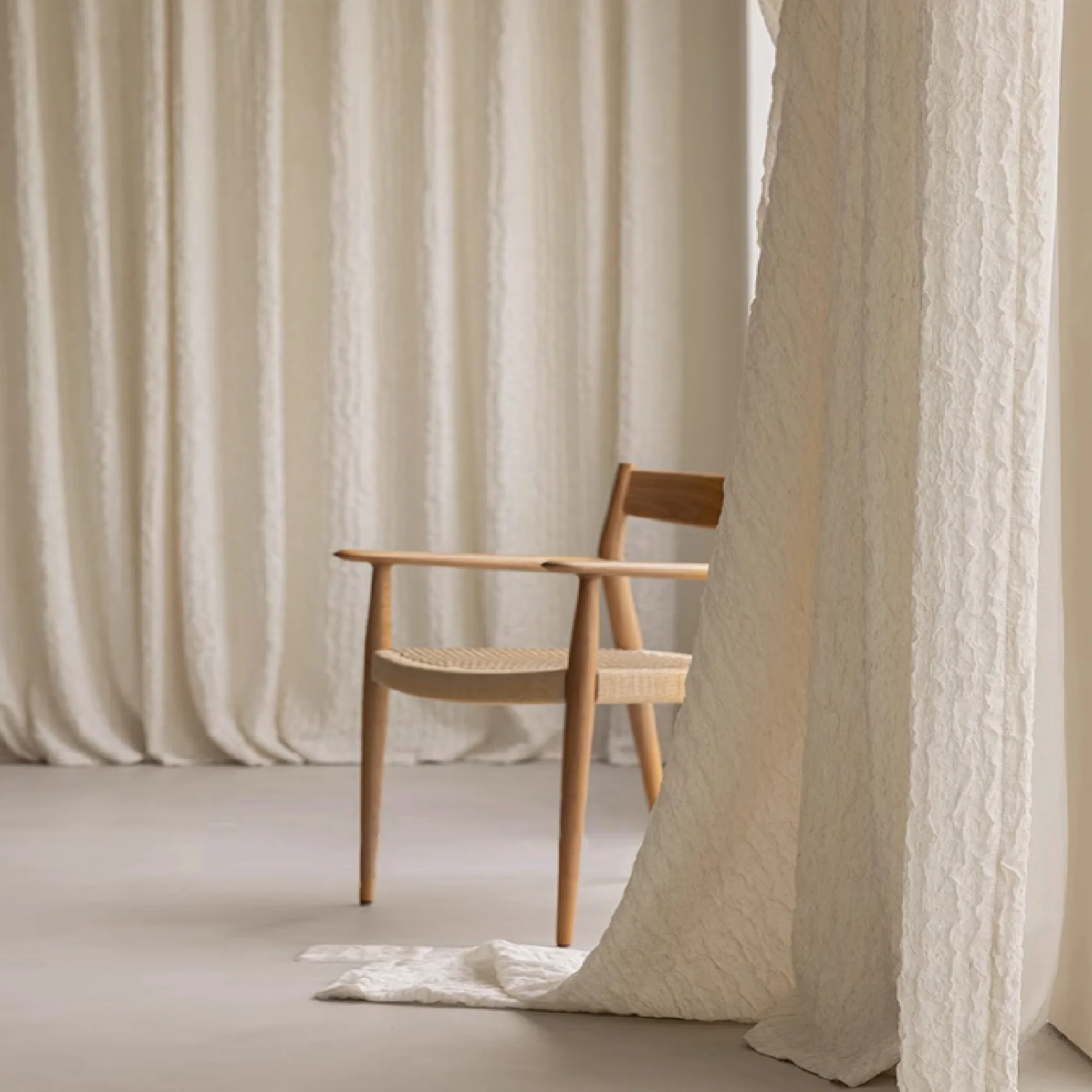 Custom curtains in beige with textured weave for a cozy living space
