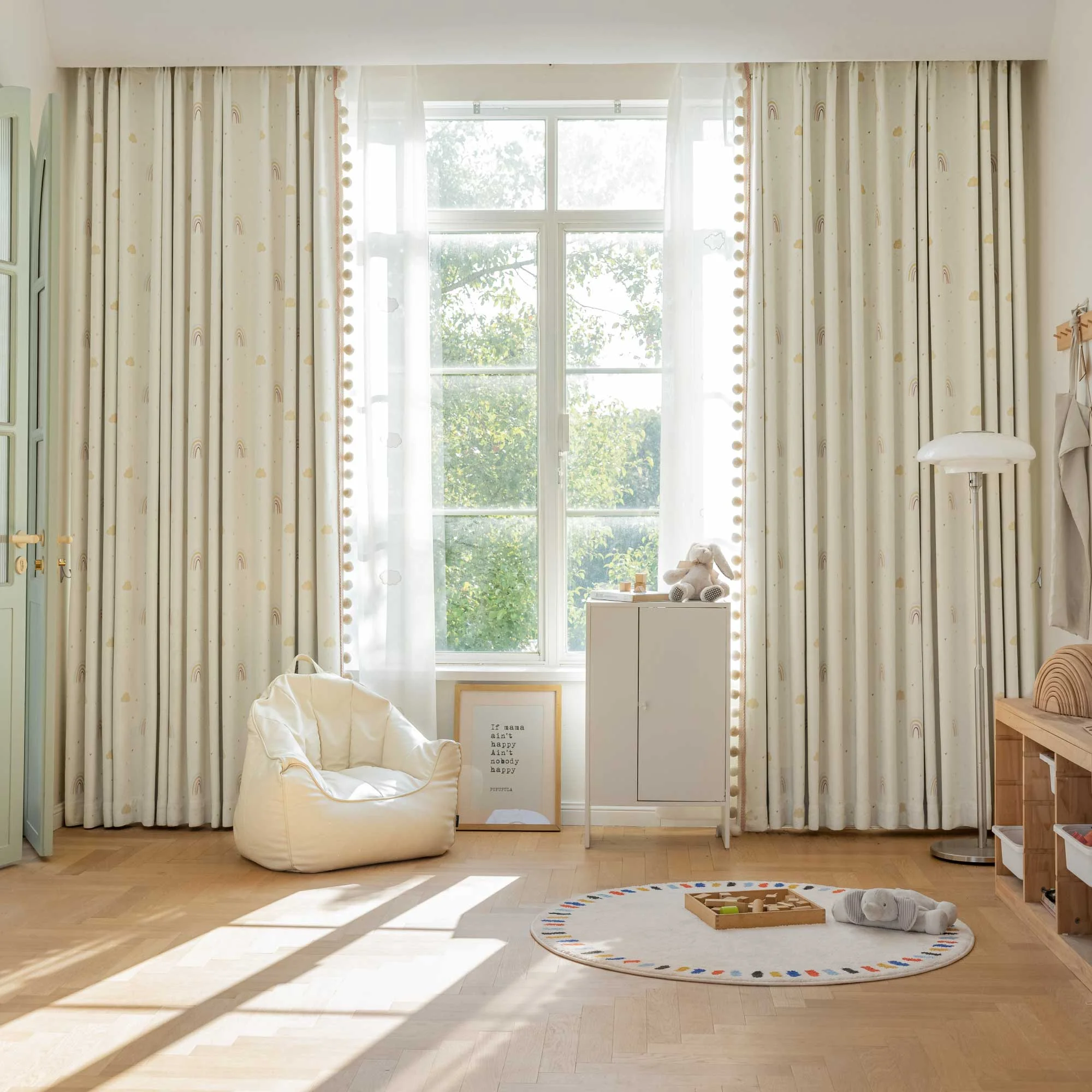 Children's room with cream cartoon curtains, rainbow and heart patterns