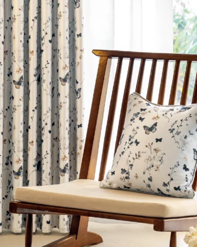 Butterfly print curtains in a bright, cozy room with wooden chair and soft natural light.