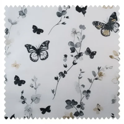 Fabric swatch of butterfly print curtain with delicate botanical pattern on light background.