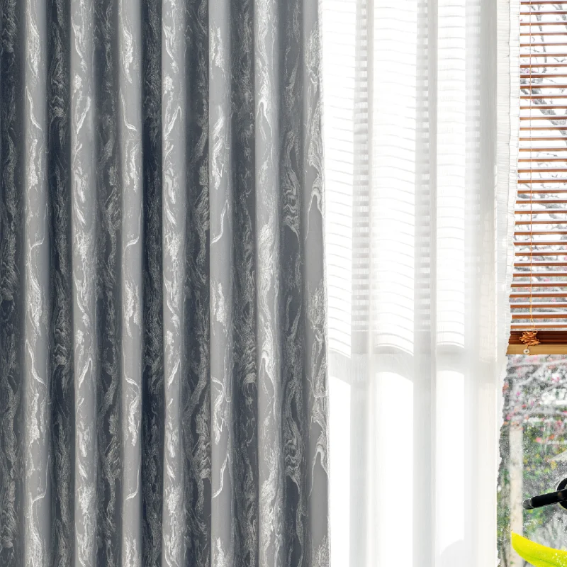 Close-up of grey stone vein jacquard curtain with natural light filtering and elegant pleats